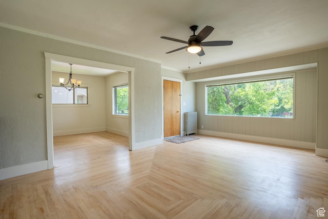 354 N 200 E, Logan, UT 84321 - spare room featuring radiator heating unit, baseboards, a chandelier, a ceiling fan, and crown molding