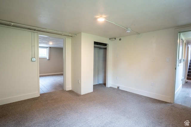 354 N 200 E, Logan, UT 84321 - unfurnished bedroom with carpet flooring, a closet, and baseboards