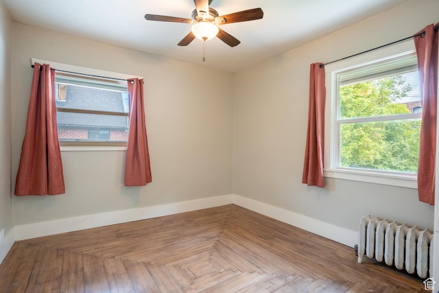 354 N 200 E, Logan, UT 84321 - empty room with radiator, baseboards, and ceiling fan