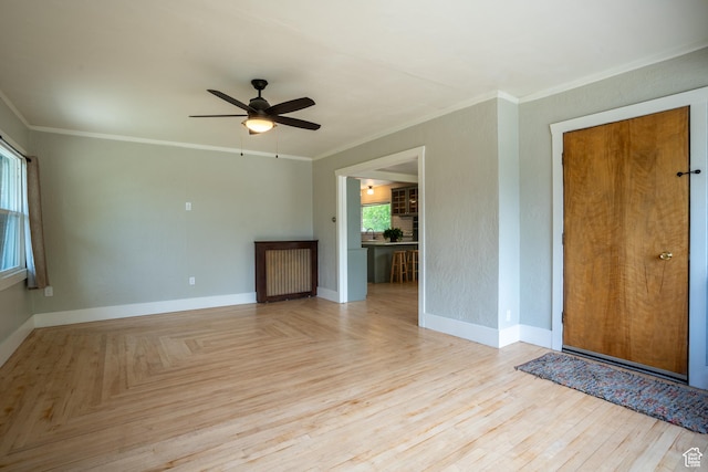 354 N 200 E, Logan, UT 84321 - unfurnished living room featuring ceiling fan, crown molding, and baseboards