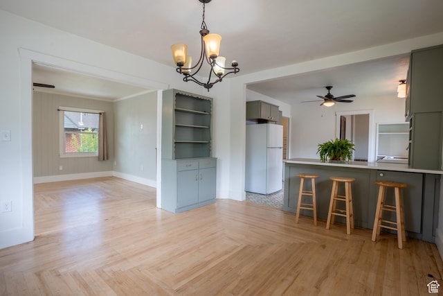 354 N 200 E, Logan, UT 84321 - unfurnished dining area featuring a chandelier, baseboards, and a ceiling fan