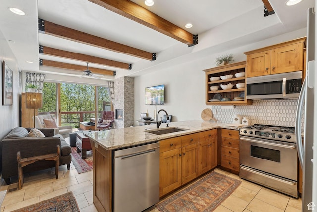 6322 N Park Ln Unit 3, Park City, UT 84098 - kitchen with appliances with stainless steel finishes, a peninsula, decorative backsplash, a sink, and open floor plan