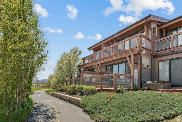 6322 N Park Ln Unit 3, Park City, UT 84098 - rear view of house featuring a hot tub and a balcony