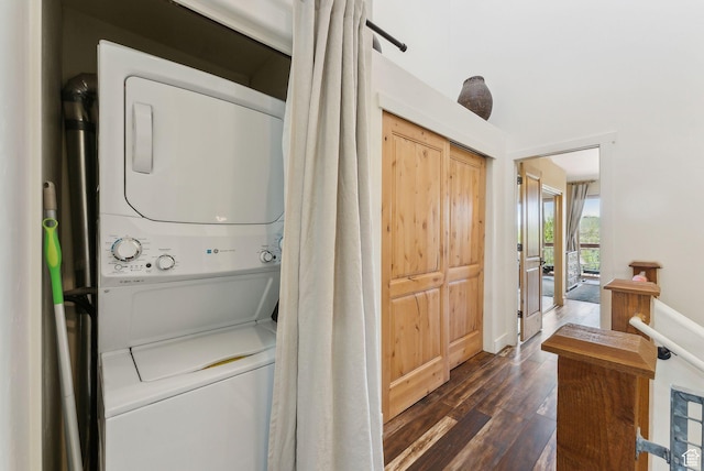 6322 N Park Ln Unit 3, Park City, UT 84098 - laundry room featuring stacked washer / drying machine, dark wood-style floors, and baseboards
