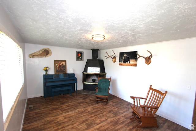 324 W 600 N, Logan, UT 84321 - living area with wood finished floors, a textured ceiling, and baseboards