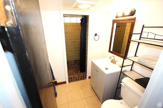 324 W 600 N, Logan, UT 84321 - full bathroom featuring toilet, vanity, tiled shower, and tile patterned flooring