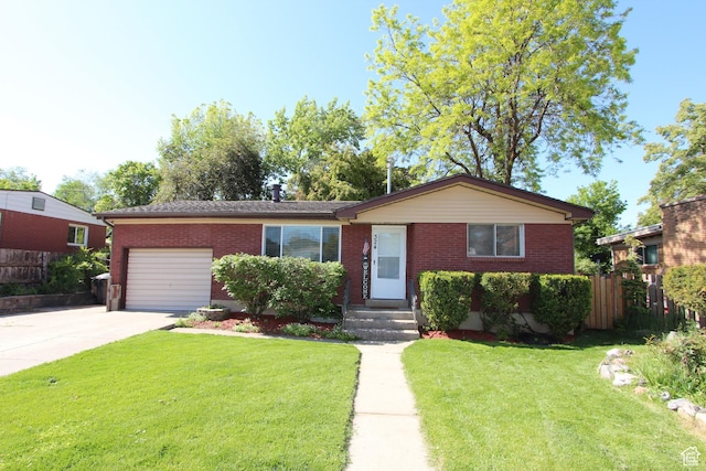 324 W 600 N, Logan, UT 84321 - ranch-style home with a garage, brick siding, and concrete driveway
