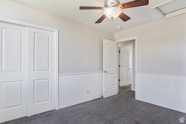 1627 W 350 N, West Point, UT 84015 - unfurnished bedroom featuring wainscoting, carpet flooring, attic access, a closet, and ceiling fan