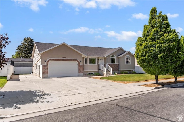 1627 W 350 N, West Point, UT 84015 - single story home with an attached garage, concrete driveway, and brick siding