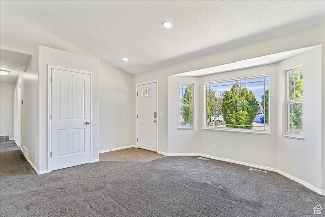 1627 W 350 N, West Point, UT 84015 - carpeted foyer entrance featuring plenty of natural light, lofted ceiling, a textured ceiling, baseboards, and recessed lighting