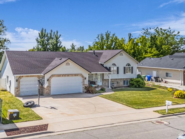 1123 N 3050 W, West Point, UT 84015 - split level home with an attached garage, driveway, a front yard, and stone siding