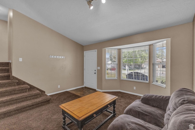 1123 N 3050 W, West Point, UT 84015 - living room with dark colored carpet, lofted ceiling, baseboards, stairway, and a textured ceiling
