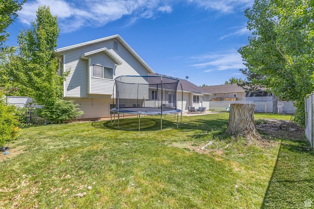 1123 N 3050 W, West Point, UT 84015 - back of house featuring a trampoline