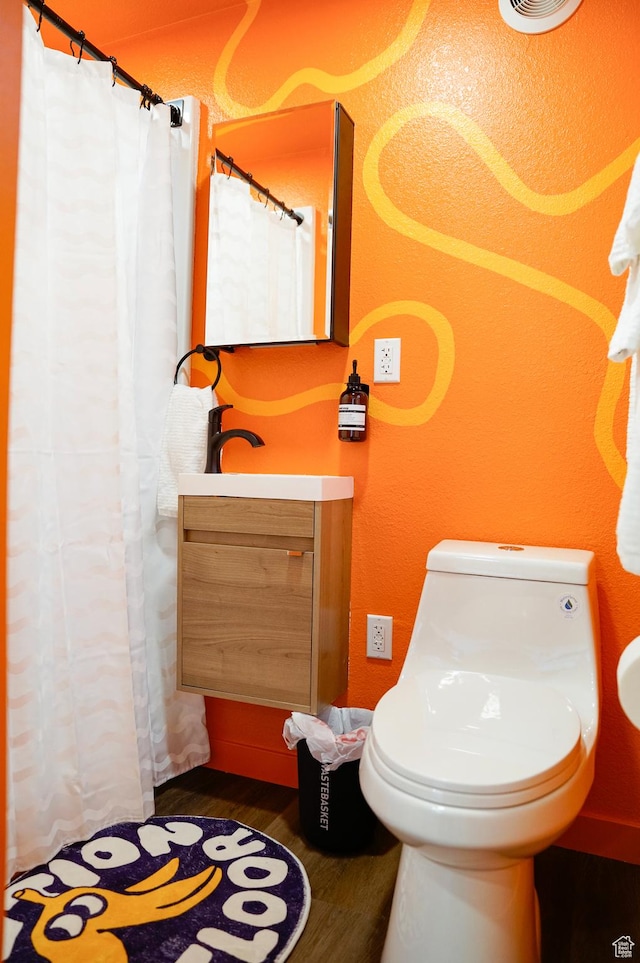 35 E Redondo Ave, Salt Lake City, UT 84115 - bathroom with wood finished floors, toilet, and vanity