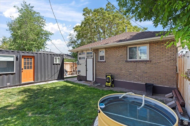35 E Redondo Ave, Salt Lake City, UT 84115 - rear view of house with brick siding and an outbuilding