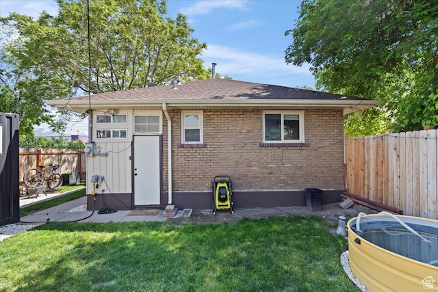 35 E Redondo Ave, Salt Lake City, UT 84115 - rear view of property featuring brick siding and roof with shingles