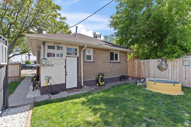 35 E Redondo Ave, Salt Lake City, UT 84115 - rear view of property with brick siding, a chimney, and a shingled roof
