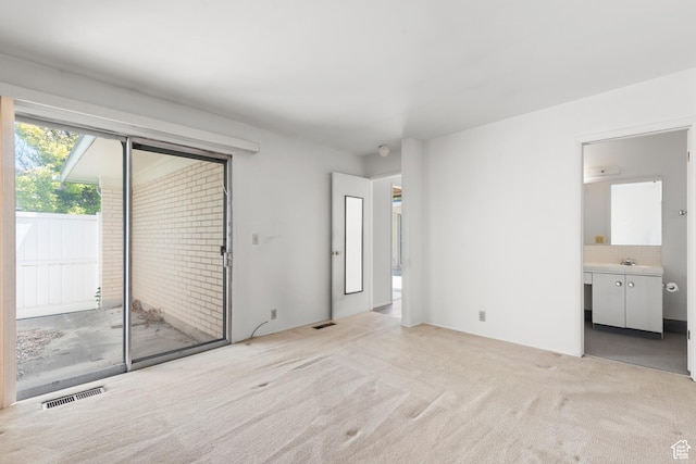3616 S 860 E Unit 72, Salt Lake City, UT 84106 - unfurnished bedroom with access to outside, light colored carpet, a sink, and ensuite bathroom