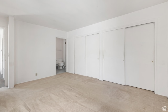 3616 S 860 E Unit 72, Salt Lake City, UT 84106 - unfurnished bedroom with two closets, carpet, and ensuite bathroom