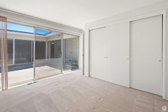 3616 S 860 E Unit 72, Salt Lake City, UT 84106 - unfurnished bedroom featuring carpet floors, access to exterior, and a closet