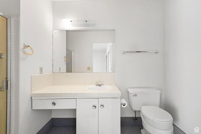 3616 S 860 E Unit 72, Salt Lake City, UT 84106 - full bathroom with toilet, tasteful backsplash, vanity, and a shower with shower door