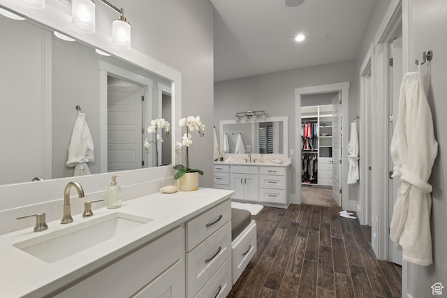 523 N Red Ct, Heber City, UT 84032 - bathroom with vanity, wood finished floors, a walk in closet, and recessed lighting