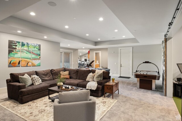 523 N Red Ct, Heber City, UT 84032 - living room with light carpet, recessed lighting, a barn door, baseboards, and a tray ceiling