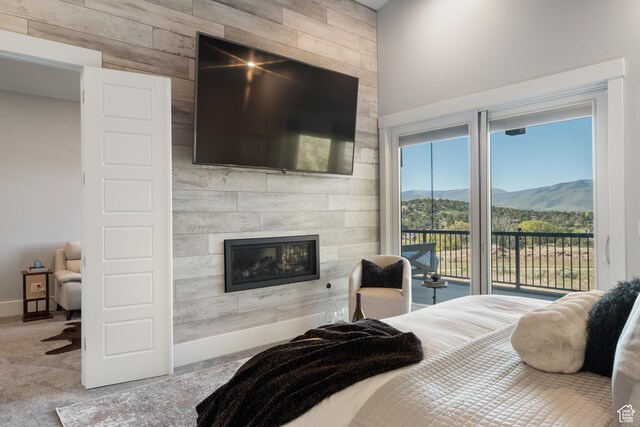 523 N Red Ct, Heber City, UT 84032 - carpeted bedroom featuring access to outside, a tile fireplace, and baseboards