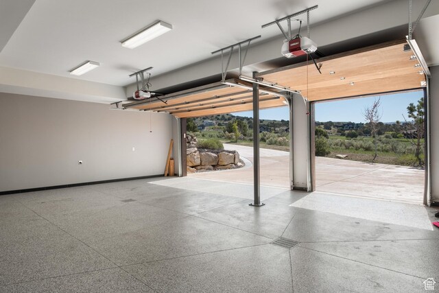 523 N Red Ct, Heber City, UT 84032 - garage featuring a garage door opener and baseboards