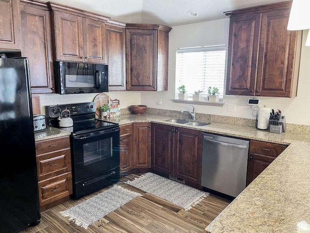 1303 N 150 E, Nephi, UT 84648 - kitchen featuring black appliances, a sink, wood finished floors, and dark brown cabinets