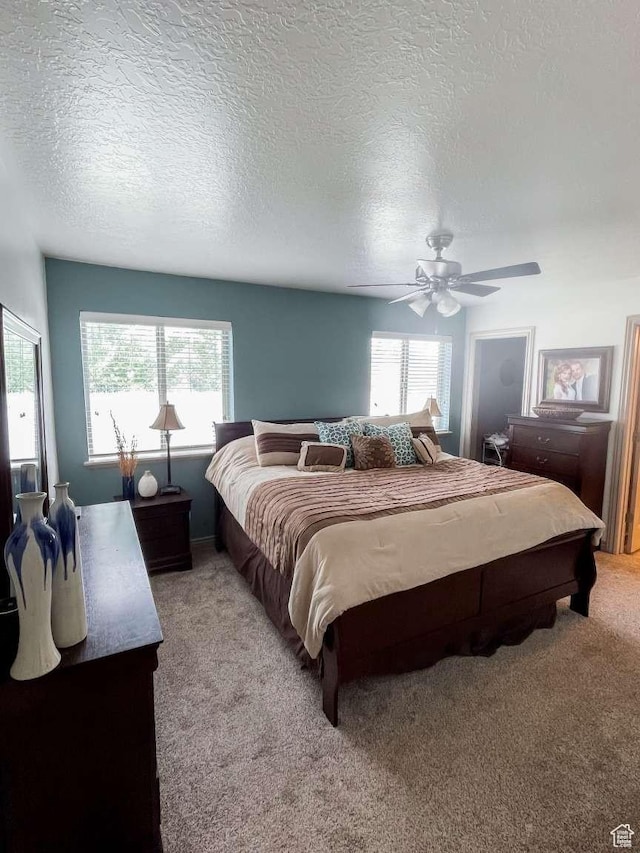 1303 N 150 E, Nephi, UT 84648 - bedroom with multiple windows, light colored carpet, a ceiling fan, and a textured ceiling