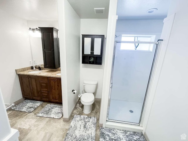 1303 N 150 E, Nephi, UT 84648 - bathroom with vanity, a stall shower, toilet, and baseboards