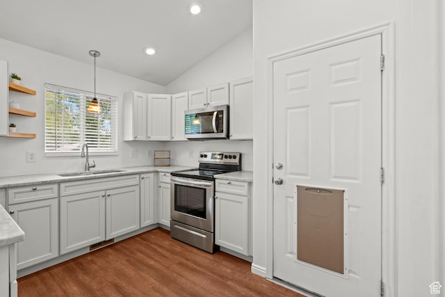 524 N 2870 W, Provo, UT 84601 - kitchen with appliances with stainless steel finishes, a sink, lofted ceiling, dark wood-type flooring, and pendant lighting