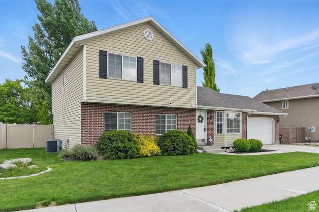 524 N 2870 W, Provo, UT 84601 - view of front of property featuring brick siding, an attached garage, and driveway