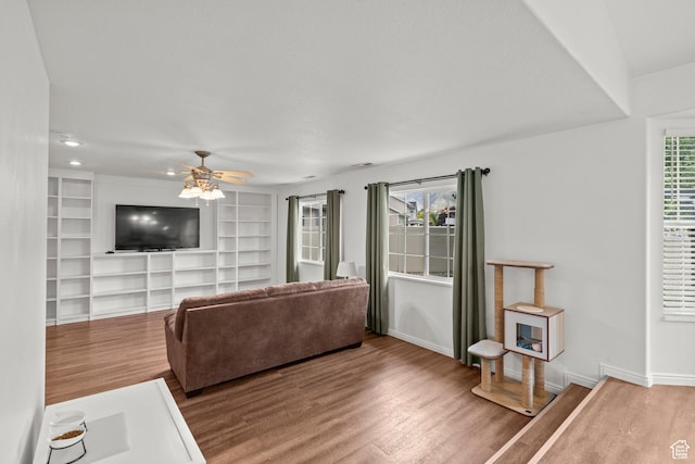 524 N 2870 W, Provo, UT 84601 - living room with wood finished floors, ceiling fan, baseboards, built in shelves, and recessed lighting