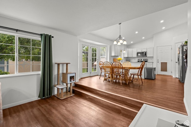 524 N 2870 W, Provo, UT 84601 - dining space with wood finished floors, lofted ceiling, recessed lighting, a chandelier, and baseboards