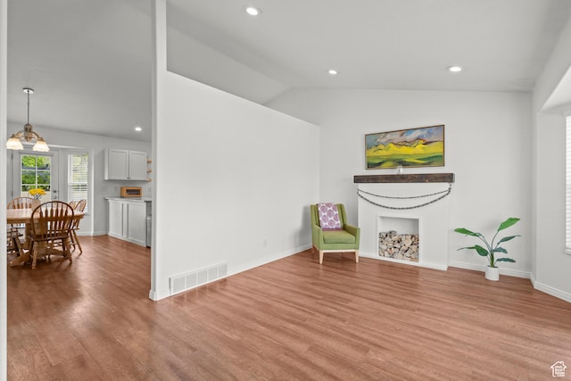 524 N 2870 W, Provo, UT 84601 - sitting room with wood finished floors, recessed lighting, a fireplace, vaulted ceiling, and baseboards