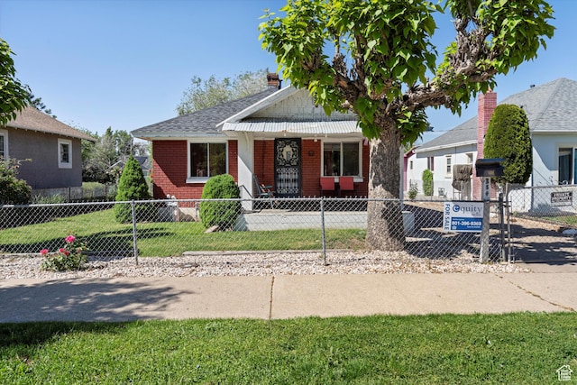 254 Franklin St, Ogden, UT 84401 - bungalow featuring brick siding, a fenced front yard, and a porch