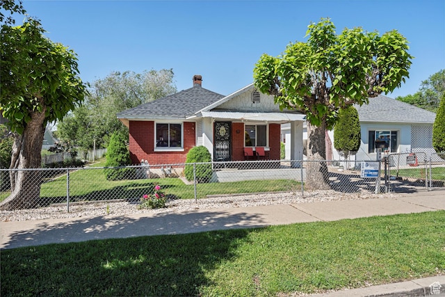 254 Franklin St, Ogden, UT 84401 - bungalow-style house with brick siding, a chimney, roof with shingles, and covered porch