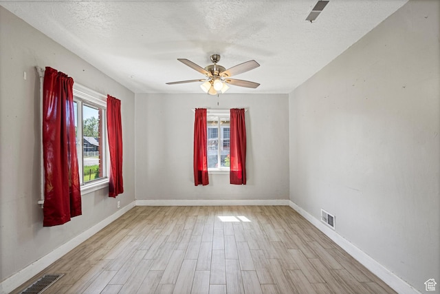 254 Franklin St, Ogden, UT 84401 - spare room featuring light wood-type flooring, a textured ceiling, baseboards, and a ceiling fan