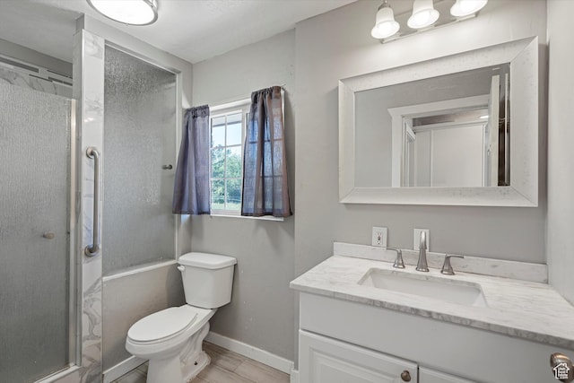 254 Franklin St, Ogden, UT 84401 - bathroom featuring vanity, toilet, a shower stall, baseboards, and wood finished floors