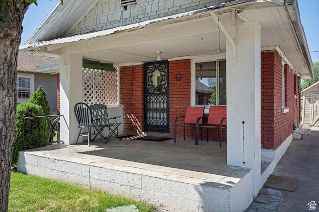254 Franklin St, Ogden, UT 84401 - view of exterior entry featuring brick siding and covered porch