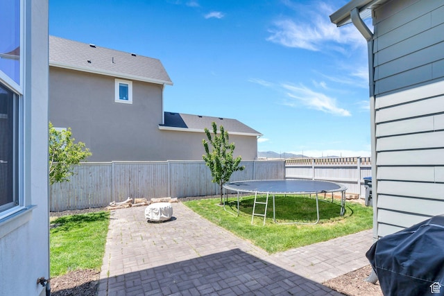 6228 W Copperhawk Dr S, South Jordan, UT 84009 - fenced backyard with a patio area and a trampoline
