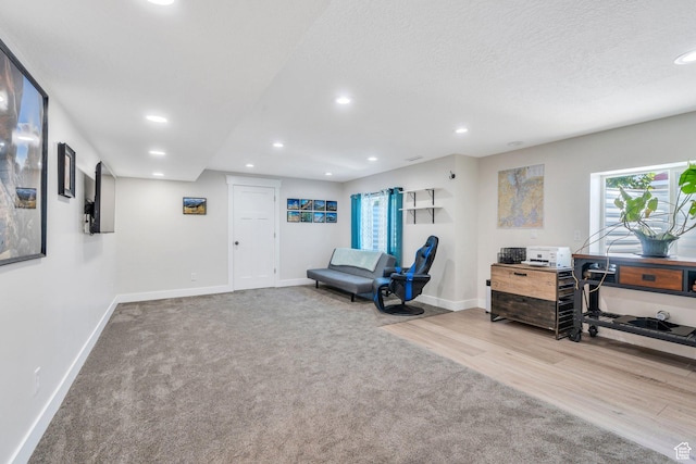6228 W Copperhawk Dr S, South Jordan, UT 84009 - sitting room featuring baseboards, recessed lighting, carpet, wood finished floors, and a textured ceiling
