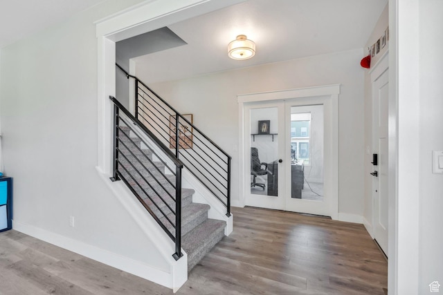 6228 W Copperhawk Dr S, South Jordan, UT 84009 - foyer with french doors, wood finished floors, stairs, and baseboards