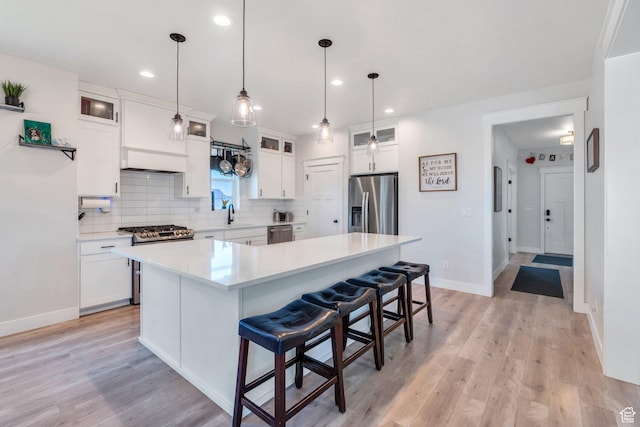6228 W Copperhawk Dr S, South Jordan, UT 84009 - kitchen featuring appliances with stainless steel finishes, decorative backsplash, white cabinets, baseboards, and recessed lighting