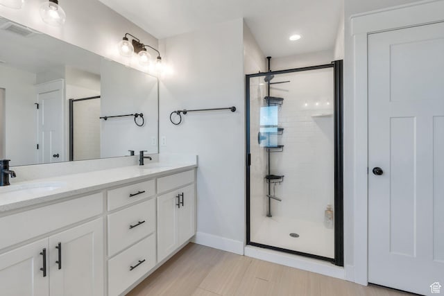 6228 W Copperhawk Dr S, South Jordan, UT 84009 - full bath featuring a shower stall, double vanity, baseboards, and recessed lighting