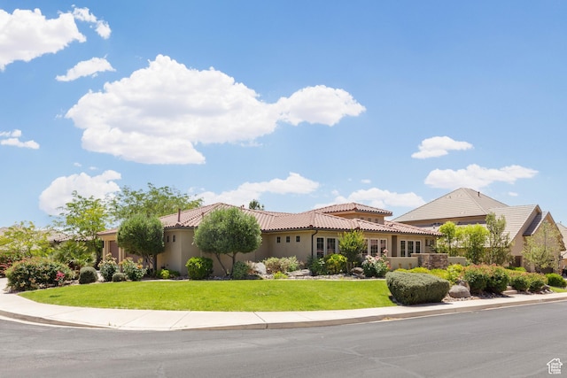 822 E Birken St, Washington, UT 84780 - mediterranean / spanish-style home featuring a tiled roof, a front yard, and stucco siding