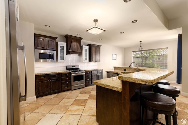 822 E Birken St, Washington, UT 84780 - kitchen with appliances with stainless steel finishes, custom range hood, a sink, dark brown cabinetry, and recessed lighting