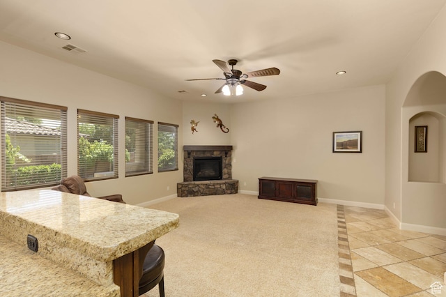822 E Birken St, Washington, UT 84780 - living room featuring a fireplace, baseboards, recessed lighting, ceiling fan, and arched walkways